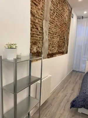 Cama o camas de una habitación en SVF76 - Loft MALASAÑA