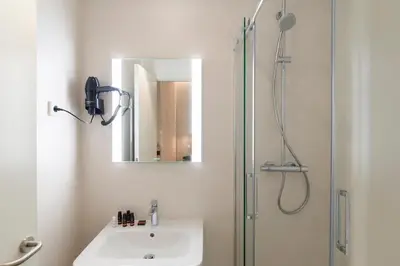 Un baño de Prado Rooms 46 - Darya Living