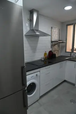 Una cocina o zona de cocina en Disfruta, en la misma Plaza Mayor bonito y amplio