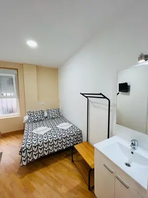 Cama o camas de una habitación en Hospedaje Puente de Vallecas