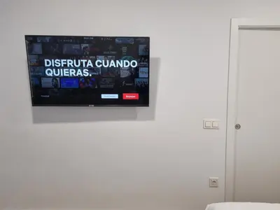 Una televisión o centro de entretenimiento en Metropolitan apartments