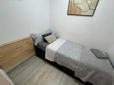 Cama o camas de una habitación en Céntrico y precioso apartamento en madrid
