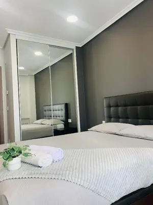 Cama o camas de una habitación en Apartamento Deluxe, 4 habitaciones, Parking