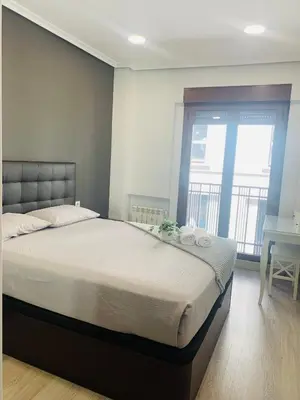 Cama o camas de una habitación en Apartamento Deluxe, 4 habitaciones, Parking