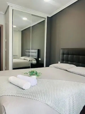 Cama o camas de una habitación en Apartamento Deluxe, 4 habitaciones, Parking