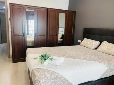 Cama o camas de una habitación en Apartamento Deluxe, 4 habitaciones, Parking