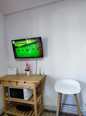 Una televisión o centro de entretenimiento en LUCERO APARTAMENTO