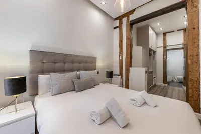 Cama o camas de una habitación en Waou La Latina III - Alquiler Corta Duración