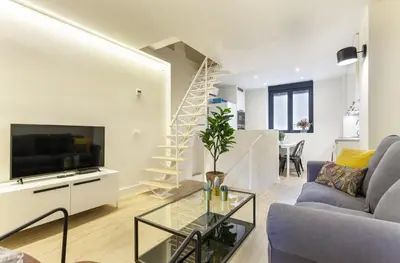 Una televisión o centro de entretenimiento en Apartamento Retiro V en Madrid