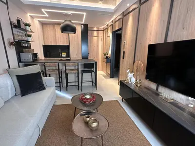 Una televisión o centro de entretenimiento en JUAN BRAVO Apartamento a estrenar con PISCINA