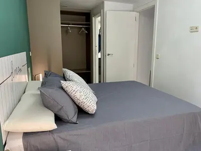 Cama o camas de una habitación en Madrid Villa Suites Aquamarina