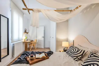Cama o camas de una habitación en LUNDA- 2 Bedroom Apartment in Malasaña
