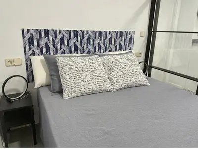 Cama o camas de una habitación en Madrid Villa Suites Bianco