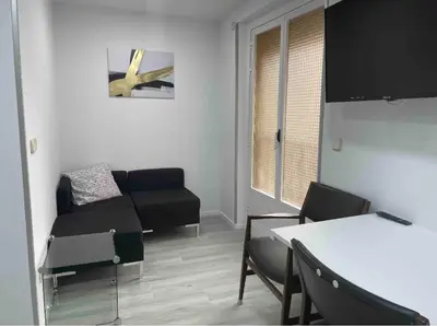 Zona de estar de Madrid Villa Suites Bianco