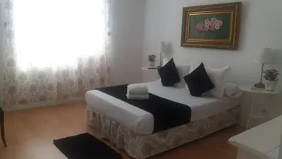 Cama o camas de una habitación en Casa de Huéspedes Prada