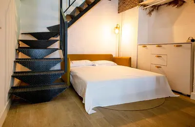 Cama o camas de una habitación en Calle Amparo 86 Lujoso Dúplex con Jacuzzi en Lavapies especial parejas
