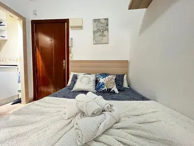 Cama o camas de una habitación en Estudio Augusto Acogedor 2 Temporal