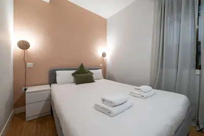 Cama o camas de una habitación en GuestReady - Un Moderno Apartamento a un Paso de la Plaza Mayor