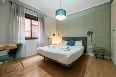 Cama o camas de una habitación en GuestReady - Un Moderno Apartamento a un Paso de la Plaza Mayor
