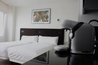 Cama o camas de una habitación en Apartamentos Centro Jardines