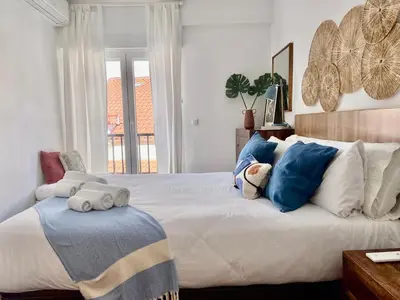 Cama o camas de una habitación en Apartamento con terraza en el centro de Madrid