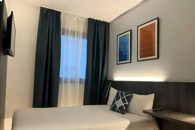 Cama o camas de una habitación en Four Points Flex by Sheraton Madrid Atocha