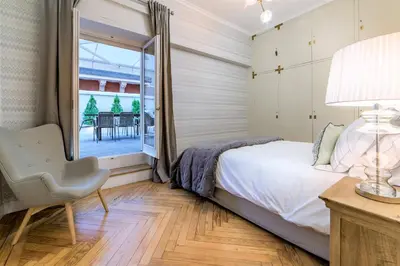 Cama o camas de una habitación en Wishome-Piso señorial con grandes terrazas y vistas al Parque del Oeste