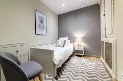 Cama o camas de una habitación en Wishome-Piso señorial con grandes terrazas y vistas al Parque del Oeste