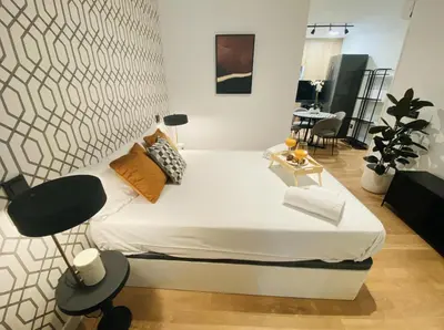 Cama o camas de una habitación en Apartamentos Madrid Río