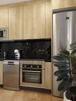 Una cocina o zona de cocina en Apartamentos Madrid Río