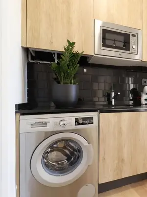 Una cocina o zona de cocina en Apartamentos Madrid Río