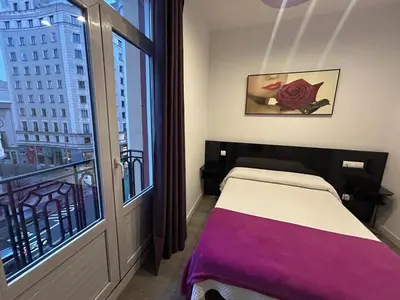 Cama o camas de una habitación en Hostal Buenos Aires Gran Vía Madrid