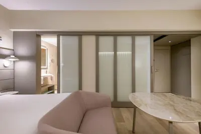 Cama o camas de una habitación en AC Hotel Carlton Madrid by Marriott