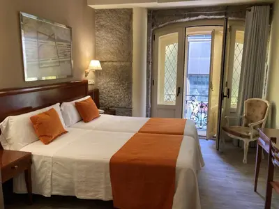 Cama o camas de una habitación en Hostal San Lorenzo