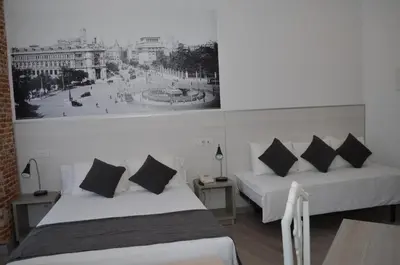 Cama o camas de una habitación en Hostal San Lorenzo