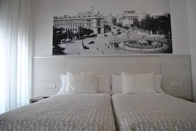 Cama o camas de una habitación en Hostal San Lorenzo