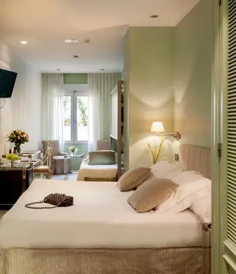 Cama o camas de una habitación en Inhala Hotel Garden