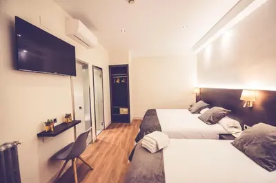 Cama o camas de una habitación en Hostal Marlasca