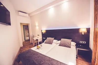 Cama o camas de una habitación en Hostal Marlasca