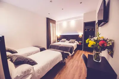 Cama o camas de una habitación en Hostal Marlasca