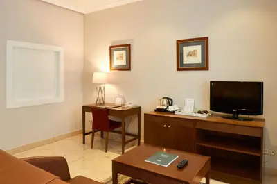 Una televisión o centro de entretenimiento en Suites Barrio de Salamanca