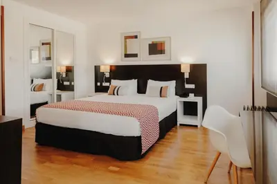 Cama o camas de una habitación en Rafaelhoteles Atocha