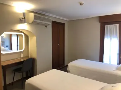 Cama o camas de una habitación en Hostal Astoria