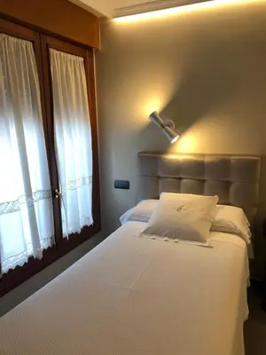 Cama o camas de una habitación en Hostal Astoria