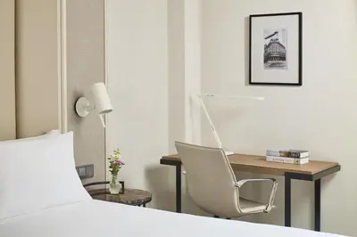 Cama o camas de una habitación en NH Madrid Nacional