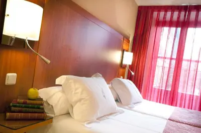 Cama o camas de una habitación en Ateneo Puerta del Sol