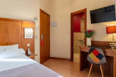 Cama o camas de una habitación en Ateneo Puerta del Sol