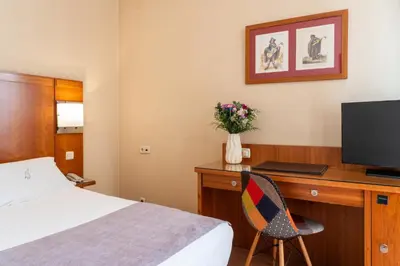 Cama o camas de una habitación en Ateneo Puerta del Sol