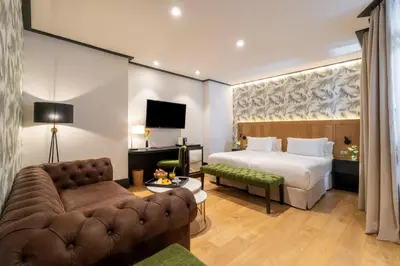 Cama o camas de una habitación en H10 Puerta de Alcalá 4 Sup