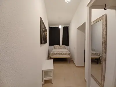Cama o camas de una habitación en For You Rentals TEMPORAL Infantas Gran Via DIN132E